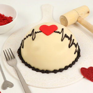round red velvet pinata cake