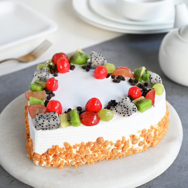 Fresh Fruit Garnished Delicious Cake e1683523699784
